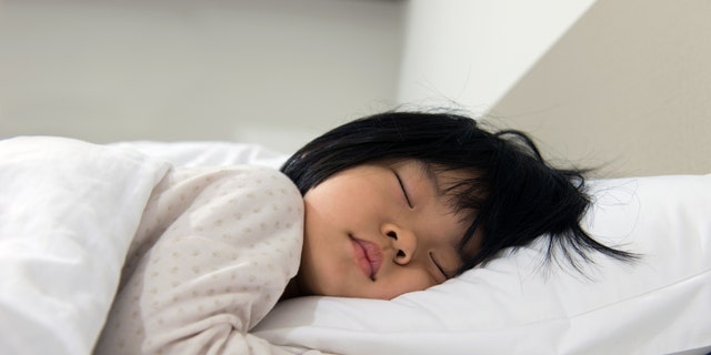 A child is sound asleep. Instead of giving their children melatonin, parents should work on encouraging good sleep habits, said one specialist.