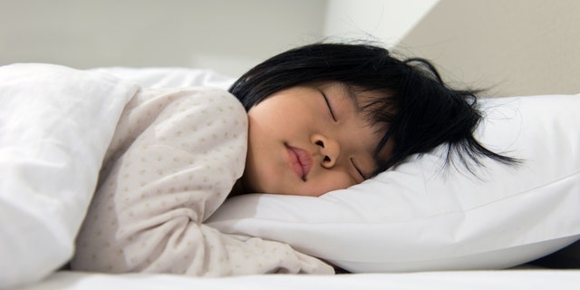 A child is sound asleep. Instead of giving their children melatonin, parents should work on encouraging good sleep habits, said one specialist.