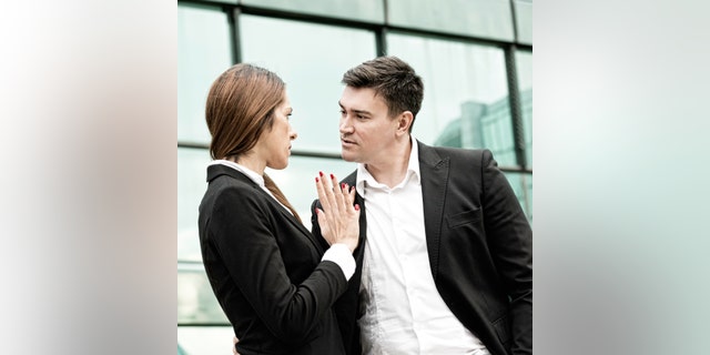 Sexual harassment at work - manager in aggressive stance towards younger female coleague