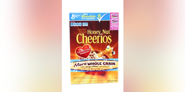 West Palm Beach, USA - December 24, 2011: This is a studio shot of a box of Honey Nut Cheerios. Cheerios are a popular American breakfast cereal made from oats and manufactured by General Mills.
