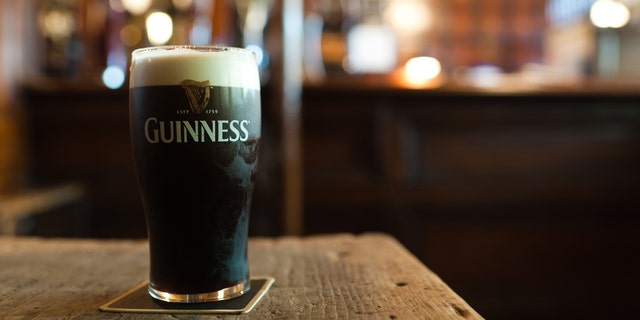 Dublin, Ireland - November 17, 2011: A pint of Guinness in traditional Irish pub.