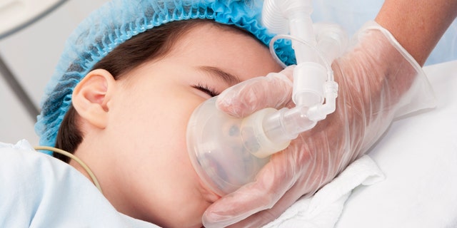 Child patient receives artificial ventilation in hospital