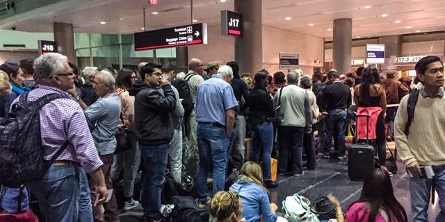 Miami, USA  - January 30, 2015: Passengers waiting at the gate for boarding on Air France flight to Paris, Miami Airport