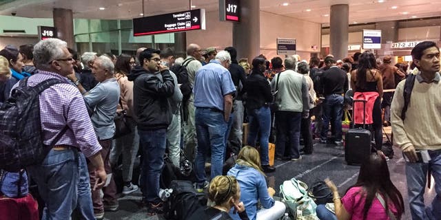 Miami, USA - January 30, 2015: Passengers waiting at the gate for boarding on Air France flight to Paris, Miami Airport