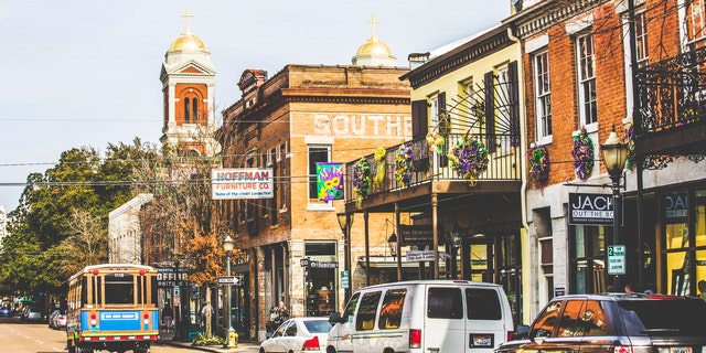 Mobile, Alabama, USA - February 24, 2014: Empty Dauphin street in historic district is ready for Mardi Gras celebrations in the evening.