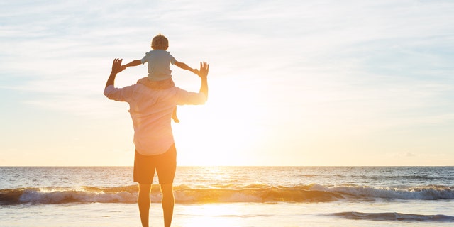 Father and son at the beach.