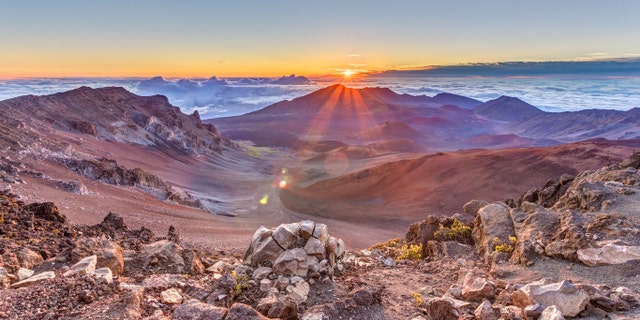 Sunrise from the summit of Haleakala volcano on the tropical island of Maui, Hawaii.