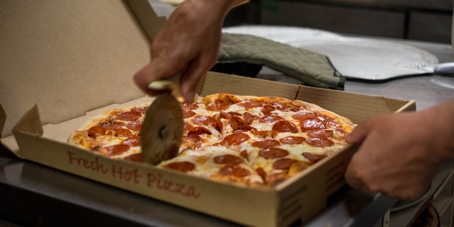 A pizzeria is under fire for alleged anti-cop slurs.