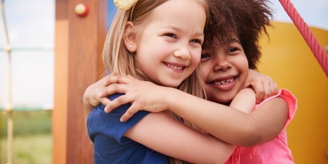 kids hugging istock