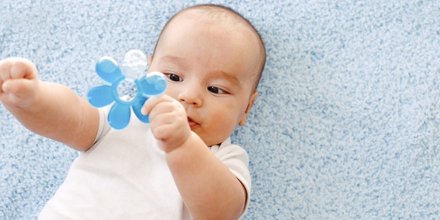Cute baby with teether