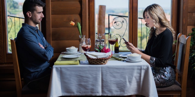 Rather than texting during dinner and pulling your attention away from others, "give your fellow diners your undivided attention," said Whitmore.