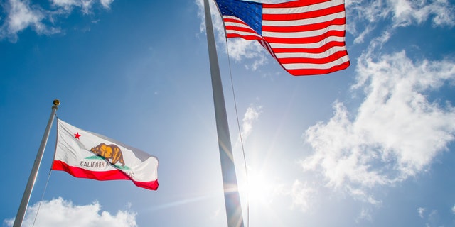 American and California State flags.
