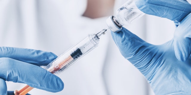 When it came time for the vaccinations, Antwon Lee held his son in his arms and told the little boy to "stay strong," while Shamekia Harris, Lee’s girlfriend, recorded the visit on her phone.