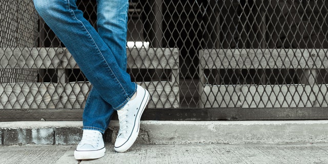 A black man was allegedly denied entry to a bar for wearing sneakers, while a group of white men wearing the same sneakers were allowed in.