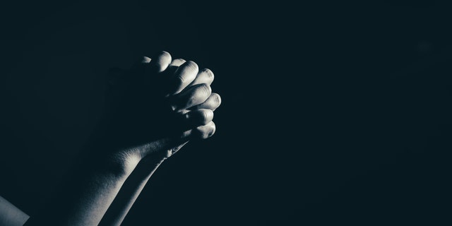 FILE -- Praying hands