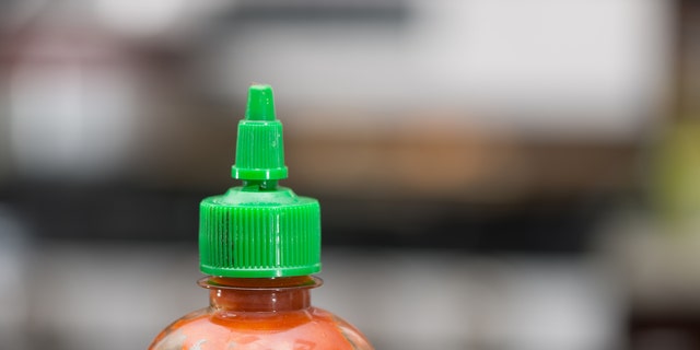 A lack of Sriracha sauce led to one man's arrest and a seriously irritated woman.
