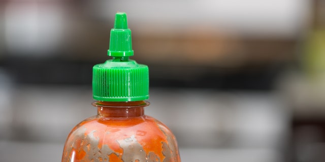 A lack of Sriracha sauce led to one man's arrest and a seriously irritated woman.
