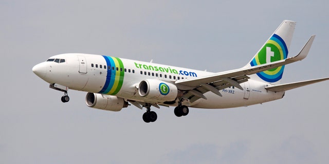 A plane was forced to land after a fight broke out over a man who allegedly refused to stop breaking wind aboard the plane.