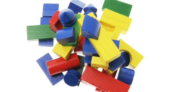 Pile of Wooden Building Blocks on White Background