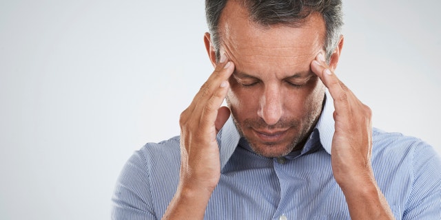 Studio shot of a mature man looking stressed out against a gray backgroundhttp://195.154.178.81/DATA/istock_collage/a3/shoots/785270.jpg