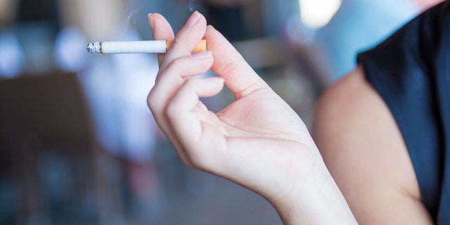 Cigarette in hand