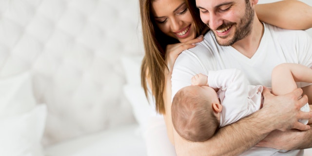 Happy family with newborn baby