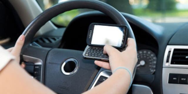 FILE: A New Jersey court has found a person who knowingly sends a text to a driver can be held liable if the driver causes an accident.