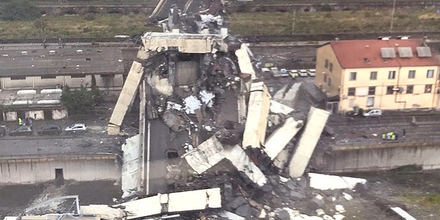 Vehicles were crushed under the rubble after the bridge in Genoa collapsed.