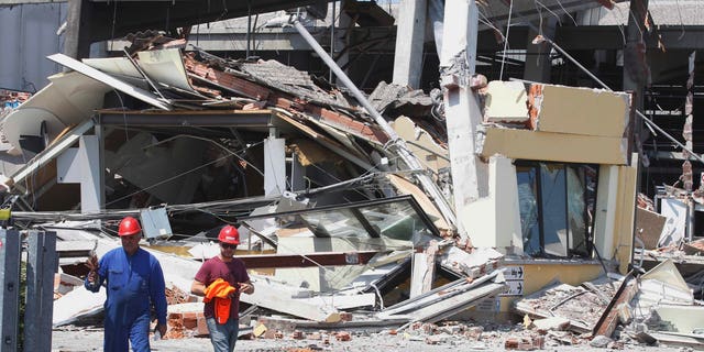 The collapsed BBG industrial moldings building is seen in Mirandola, northern Italy, Tuesday, May 29, 2012.