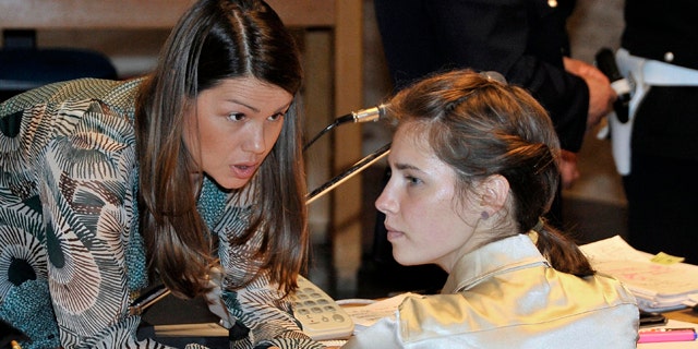 May 21: Amanda Knox, right, listens to her lawyer Maria Del Grosso, at the Perugia court, Italy.
