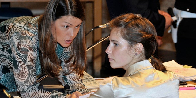 May 21: Amanda Knox, right, listens to her lawyer Maria Del Grosso, at the Perugia court, Italy.