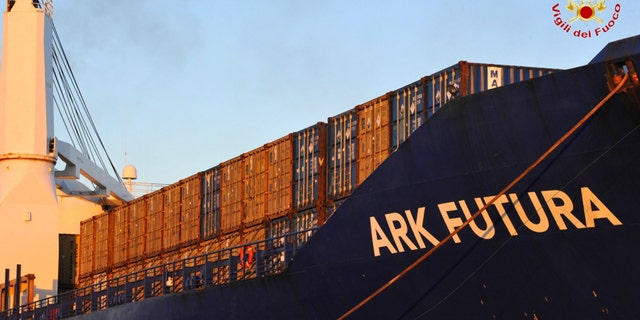 July 2, 2014: In this photo provided by the "Vigili del Fuoco" (Italian firefighters), containers are lined up on the deck of the Danish vessel Ark Futura, moored at Gioia Tauro port, southern Italy.