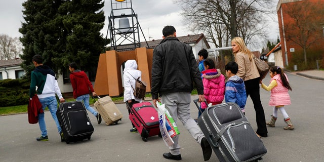 April 4, 2016: Syrian refugees arrive at the camp for refugees and migrants in Friedland, Germany.