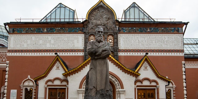 In this photo taken on Thursday, Feb. 11, 2016, a view of the Tretyakov State Gallery museum with the statue of the founder of the gallery Pavel Tretyakov in the center in Moscow, Russia.
