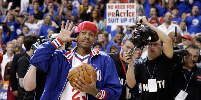 Former Philadelphia 76er Allen Iverson acknowledges the crowd as he brings in the game ball before Game 6 of an NBA basketball Eastern Conference semifinal playoff series between the 76ers and the Boston Celtics, Wednesday, May 23, 2012, in Philadelphia. (AP Photo/Matt Slocum)