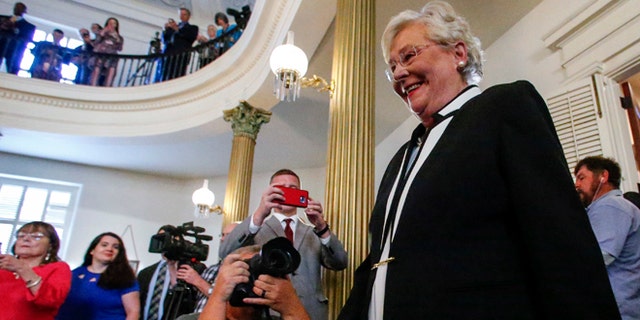 April 10, 2017: Kay Ivey walks in to be sworn in as the next Governor of Alabama in Montgomery, Ala. 