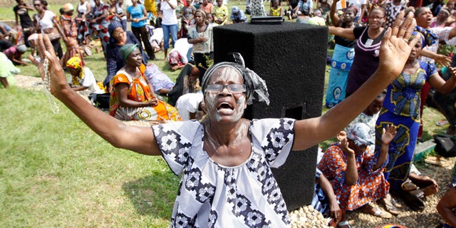 Dec. 27: A member of the Ivory Coast Christian Women Association prays for peace in Abidjan. Fears of a regional military intervention grew Monday in Ivory Coast following a threat from West African neighbors to force out incumbent leader Laurent Gbagbo if he does not soon heed international calls to step down from power. (AP)