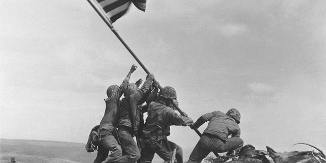 FILE - In this Feb 23, 1945 file photo, U.S. Marines of the 28th Regiment, 5th Division, raise the American flag atop Mt. Suribachi, Iwo Jima, Japan. (AP)