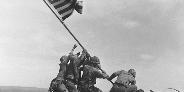 FILE - In this Feb 23, 1945 file photo, U.S. Marines of the 28th Regiment, 5th Division, raise the American flag atop Mt. Suribachi, Iwo Jima, Japan. (AP)
