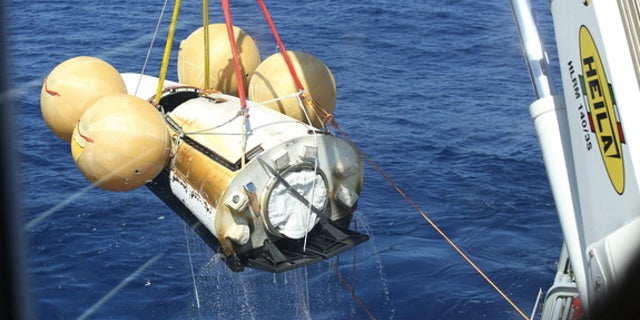 Europe's Intermediate eXperimental Vehicle robotic space plane is pulled out of the ocean after its first test flight on Feb. 11, 2015. European Space Agency officials are already planning the spacecraft's next test.