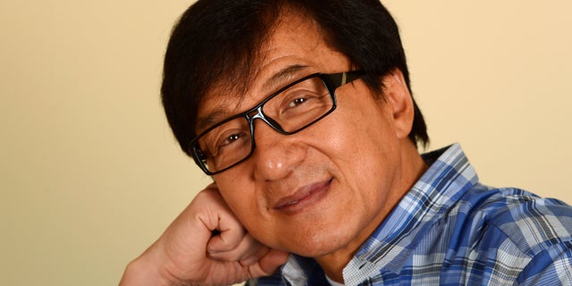 Hong Kong actor Jackie Chan poses during a promotional event for his film "Chinese Zodiac" in Beverly Hills, California October 16, 2013. Hong Kong martial arts film star Chan, 59, who declared last year at France's Cannes film festival that he was retiring from action films, now says that after more than a decade of contemplating quitting, he is going to let his body decide. As Chan starts to enter his twilight years he laments how Hollywood typecasting may force him to begin using a stunt double for his acrobatic scenes as he believes Hollywood studios would never cast him in dramatic roles. Picture taken October 16, 2013. To match story PEOPLE-JACKIECHAN/ REUTERS/Phil McCarten (UNITED STATES - Tags: ENTERTAINMENT PROFILE HEADSHOT) - RTX14FYI