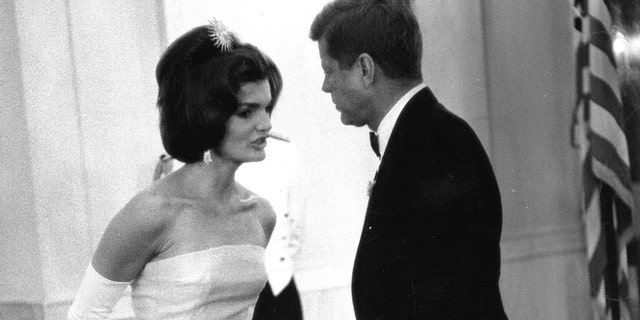 Former United States President John F. Kennedy and first lady Jackie Kennedy attend a dinner in honor of Andre Malraux, minister of state for cultural affairs of France, in Washington, in this handout image taken on May 11, 1962. November 22, 2013 will mark the 50th anniversary of the assassination of President Kennedy. REUTERS/Robert Knudsen/The White House/John F. Kennedy Presidential Library (UNITED STATES - Tags: POLITICS ANNIVERSARY) ATTENTION EDITORS - THIS IMAGE WAS PROVIDED BY A THIRD PARTY. FOR EDITORIAL USE ONLY. NOT FOR SALE FOR MARKETING OR ADVERTISING CAMPAIGNS. THIS PICTURE IS DISTRIBUTED EXACTLY AS RECEIVED BY REUTERS, AS A SERVICE TO CLIENTS - RTX15FKN