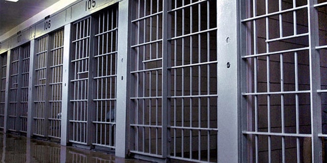 Prison bars are shown.