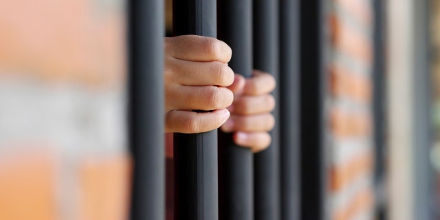 hands in jail