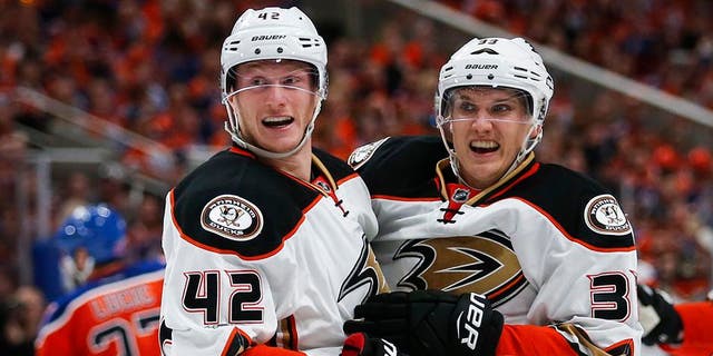 Anaheim Ducks' Jakob Silfverberg, right, from Sweden, celebrates his goal with teammate Josh Manson during the third period of Game 3 in a second-round NHL hockey Stanley Cup playoff series against the Edmonton Oilers in Edmonton, Alberta, Sunday, April 30, 2017. (Jeff McIntosh/The Canadian Press via AP)
