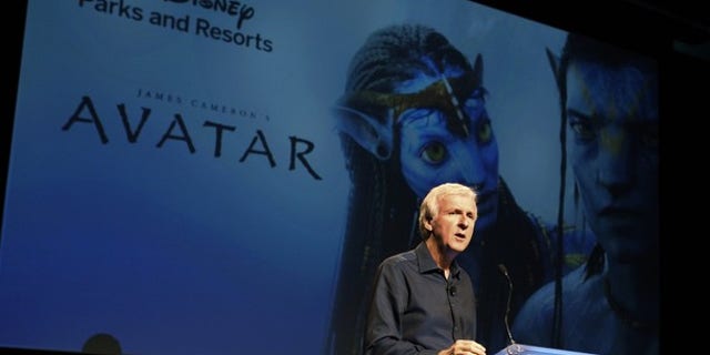Director James Cameron announce a long-term agreement which will bring "Avatar" themed lands to Disney parks with the the first at Walt Disney World in Orlando, Florida, as he speaks at a media briefing in Glendale, Calfornia September 20, 2011. A scene from "Avatar" is shown on screen background. REUTERS/Fred Prouser (UNITED STATES - Tags: ENTERTAINMENT BUSINESS)