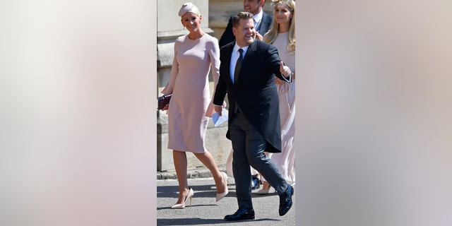 James Corden and his wife Julia Carey arrive for the wedding ceremony of Prince Harry and Meghan Markle at St. George's Chapel in Windsor Castle in Windsor, near London, England, Saturday, May 19, 2018. (Toby Melville/pool photo via AP)