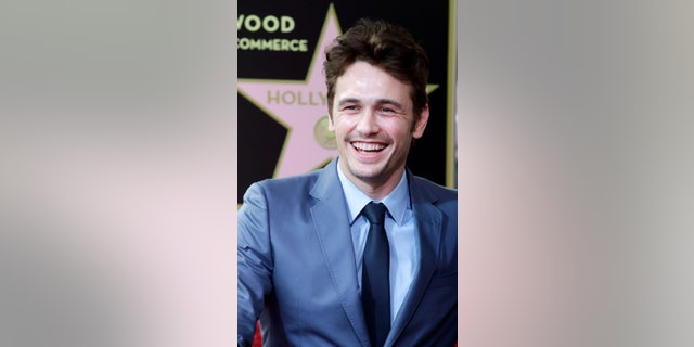 Actor James Franco smiles during ceremonies unveiling his star on the Hollywood Walk of Fame, in Hollywood March 7, 2013. REUTERS/Fred Prouser (UNITED STATES - Tags: ENTERTAINMENT) - RTR3EPJH