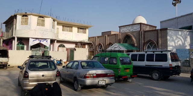 Outside Maulana Aziz's compound in Islamabad.