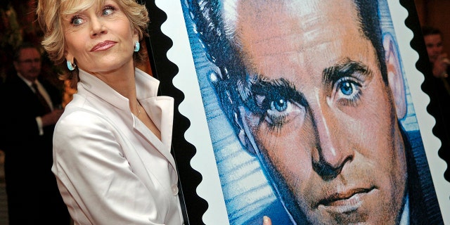 Actress Jane Fonda, daughter of the late actor Henry Fonda, poses with a design of the new Henry Fonda U.S. commemorative postage stamp, at the Academy of Motion Picture Arts and Sciences in Beverly Hills, California, May 20, 2005.